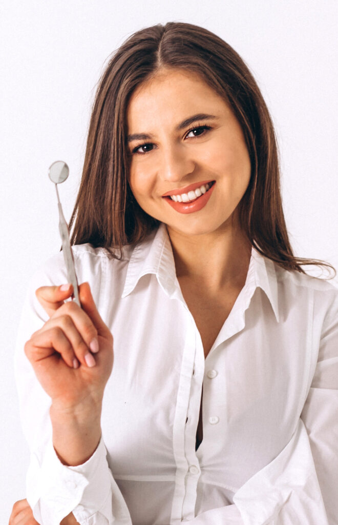 Female Dentist with Dentistry Tools
